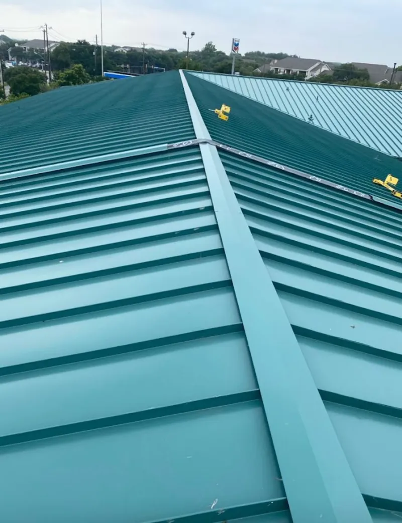 Green commercial metal roof ridge and valley for Metal Roof Repair in Moultonborough