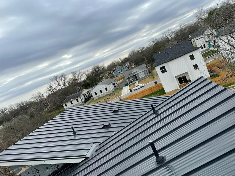 Standing seam metal roof panels with vents for Skylight Repair in Moultonborough